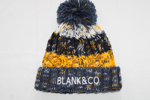 Corkscrew pom pom beanie
