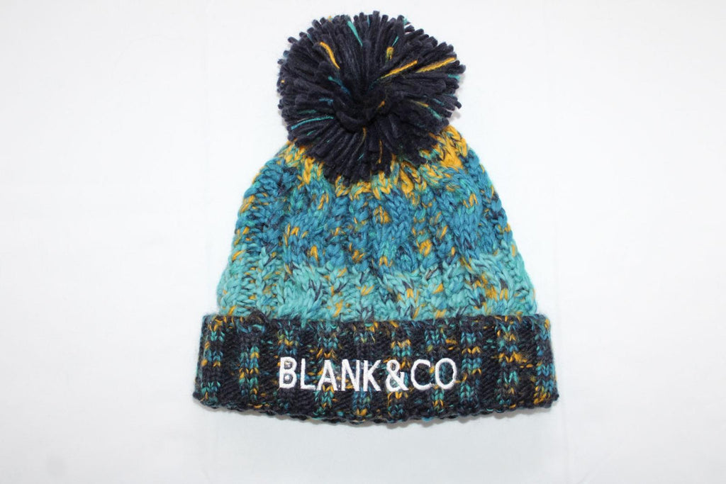 Corkscrew pom pom beanie